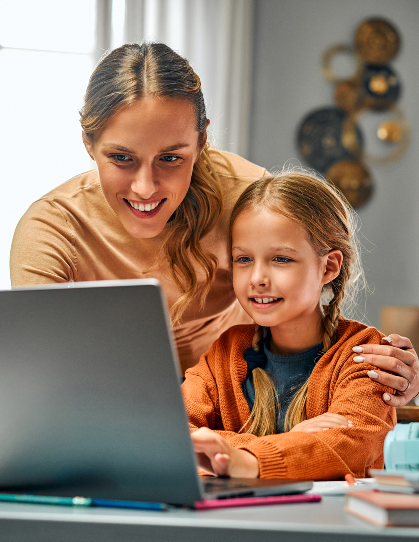 mom and daughter enrolling online